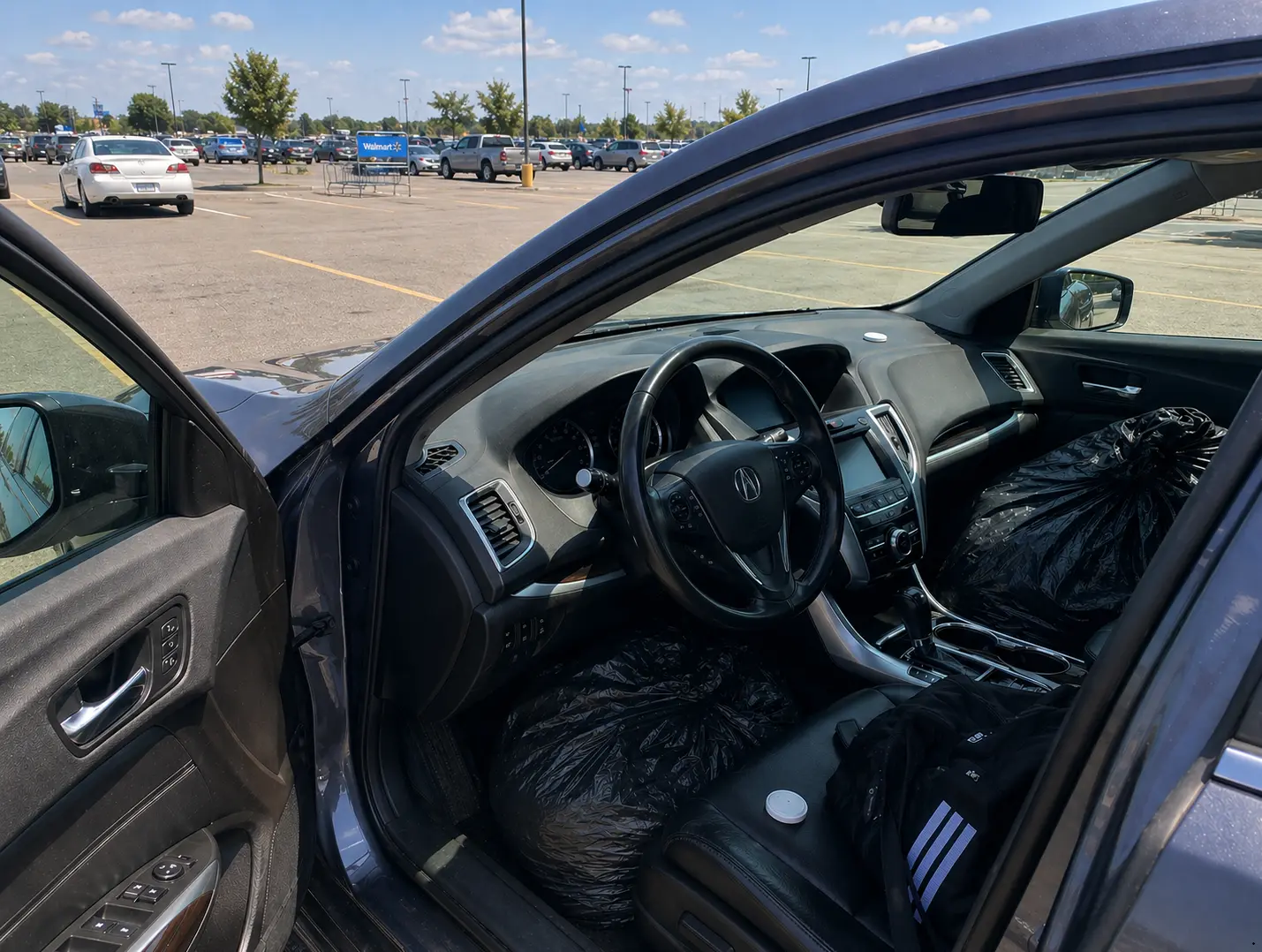 A car parked in direct sun in an open lot, the test setup for our hot car bed bug experiment